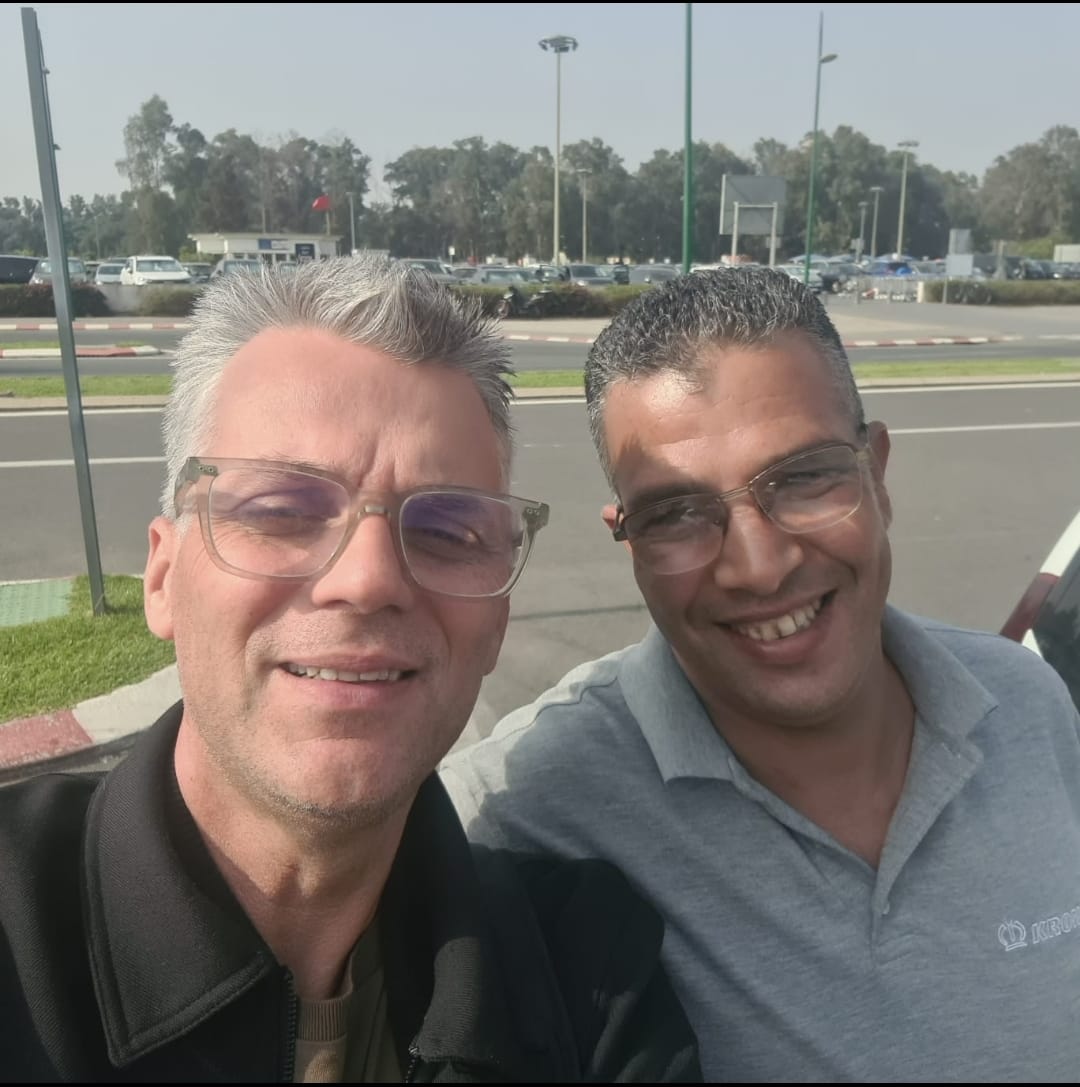 Driver in front of his vehicle at Rabat-Salé Airport